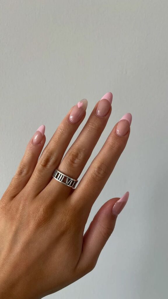 14. Minimal Light Pink French Nails with a Heart