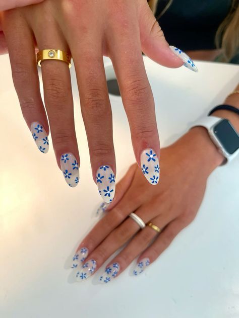 3. Fine Blue Flowers on Nails